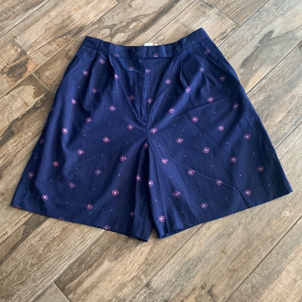 Nancy Haley in good condition, navy blue with diamond pattern shorts.